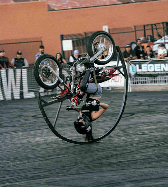 Image of a moto stunt rider doing tricks